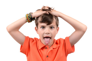 young boy with hands in hair and tongue sticking out isolated white background