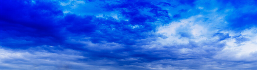 Horizontal wide panorama blue vivid cloudscape background backdr
