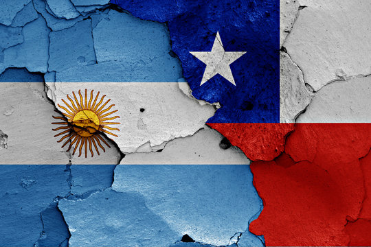 flags of Argentina and Chile painted on cracked wall