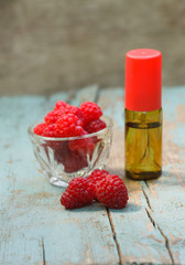 Red Raspberry Oil container with red raspberry