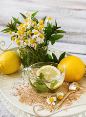 Chamomile tea with lemon and mint. Herbal tea. Dietary menu. Proper nutrition.