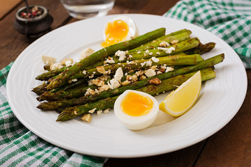 Warm salad of roasted asparagus, feta cheese and eggs