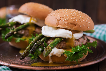 Hamburger (Sandwich) with chicken burger, lettuce, asparagus, poached egg and tartar sauce