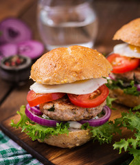 Hamburger (Sandwich) with chicken burger, lettuce, tomato, fried egg and tartar sauce