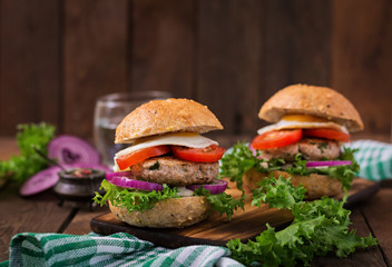 Hamburger (Sandwich) with chicken burger, lettuce, tomato, fried egg and tartar sauce