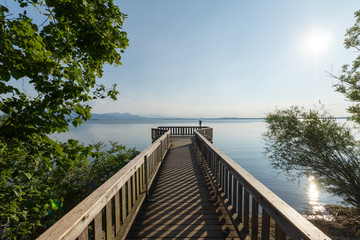 Lookout point at Chieming Lake Chiemsee in Bavaria with alps