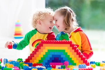 Fototapeta premium Kids playing with colorful blocks