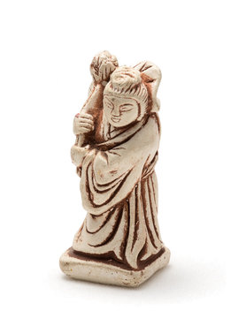 Netsuke of old woman in a dressing gown. Isolated