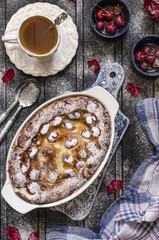 Clafoutis with cherries and powdered sugar for breakfast  