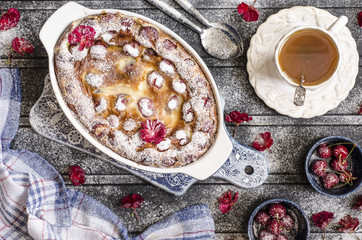 Clafoutis with cherries and powdered sugar for breakfast  