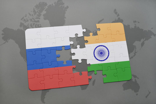puzzle with the national flag of russia and india on a world map background.