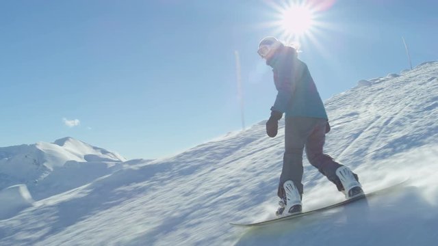 SLOW MOTION: Snowboarding down the ski slope