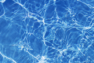 Pool water with sun reflection