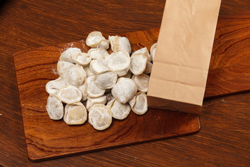Tortellini on a wooden table