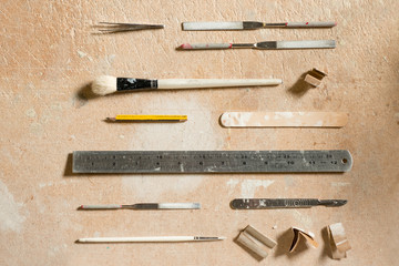Arts and Crafts Equipment Flat Lay on Wooden Surface