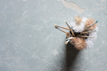 Paintbrushes in a Can on a Stone Surface with Copy Space