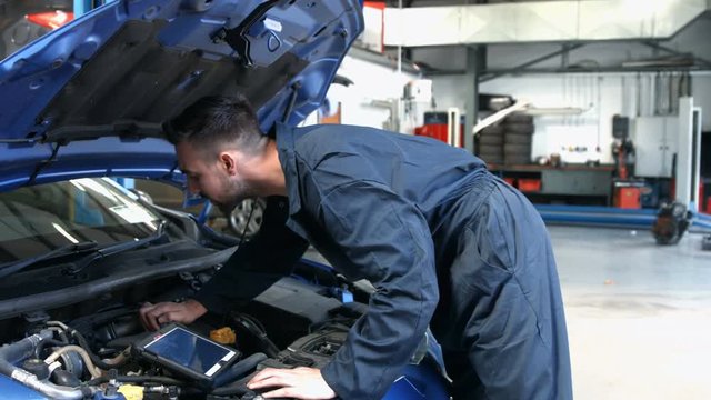 Mechanic overhauling an engine in the garage