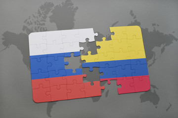 puzzle with the national flag of russia and colombia on a world map background.