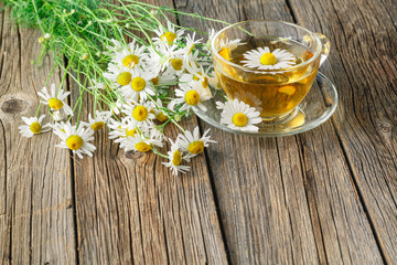 Obraz na płótnie Canvas herbal tea with organic herbs in a glass cup