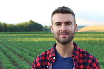 Fototapeta premium Handsome farmer standing proud and satisfied 