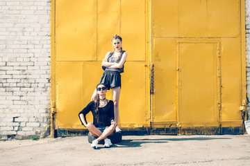 lifestyle outdoor portrait of two pretty best friends