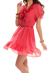 Woman wearing short sleeve dress. Dotted pattern on red dress. Beautiful girl in stylish clothes. Set of quality accessories.