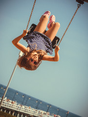 Playful crazy girl on swing.