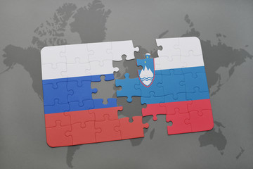 puzzle with the national flag of russia and slovenia on a world map background.