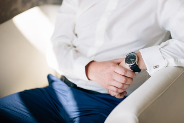 male hands close up holding the wrist