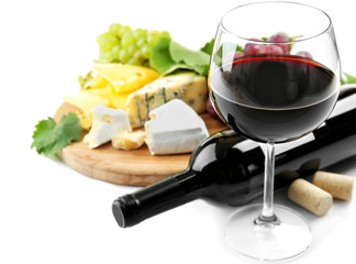 Red wine with grapes and cheese, isolated on white