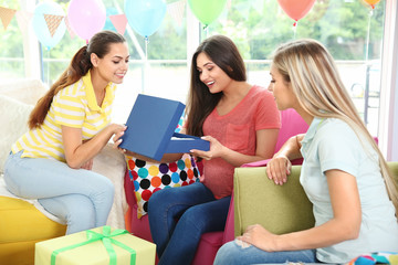 Pregnant woman and friends at baby shower party