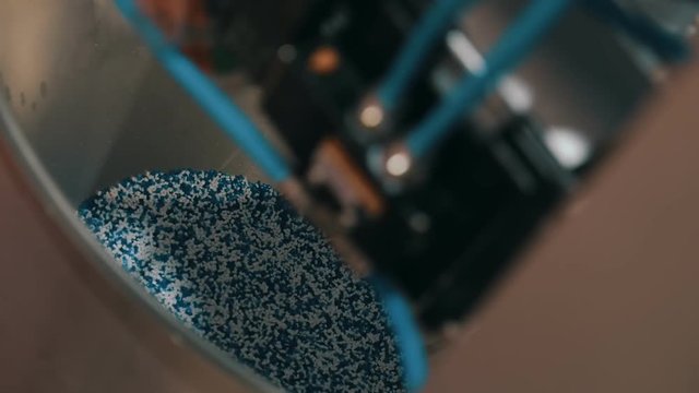 Loading the plastic granules into a container of the extrusion equipment