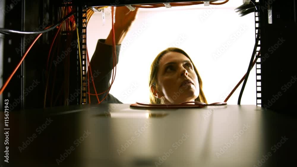 Poster Technician looking at open server locker