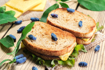 Toast with cheese, lettuce and honeysuckle.