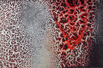 Cracked red paint on grunge metal surface - macro 18