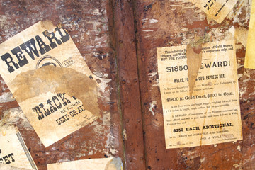Wild West wanted posters. Old paper texture on old rusty metal background 