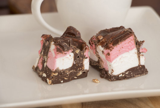 Rocky Road Dessert On A White Plate With Coffee Cup