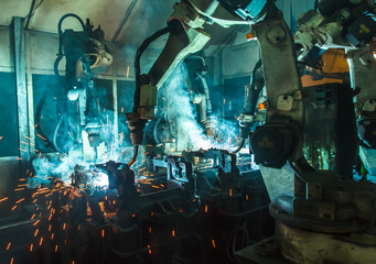 Fototapeta premium Welding robots movement in a car factory