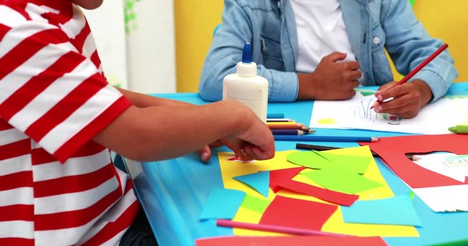 Cute little boys having art time in the classroom