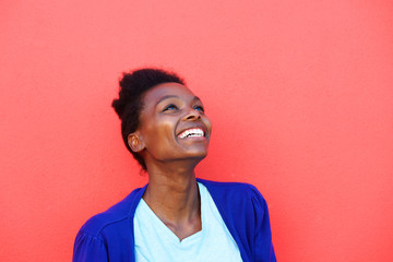 Beautiful young african female looking away and smiling