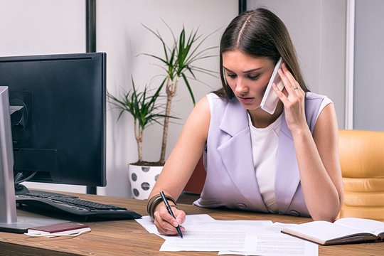 Elegant businesswoman busy at work