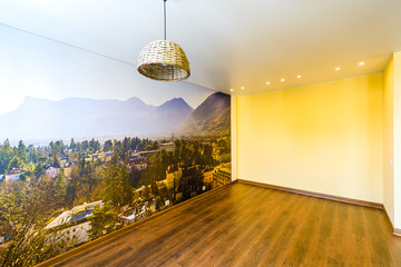 Interior of an empty room in orange tones with a panorama photo wall mural Merano (South Tyrol, Italy) - obrazy, fototapety, plakaty