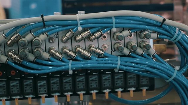 To the unit of the equipment is connected many blue wires for machine control