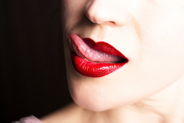 Naklejka premium Sexy Lips. Beauty Red Lip Makeup Detail. Beautiful Make-up Closeup. Sensual Open Mouth. Model Woman's Face closeup