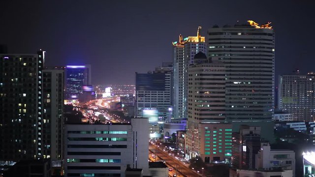 night city lights and traffic in Bangkok as abstract background, business building light, bird eyes high angle view