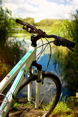 Fototapeta na wymiar Bicycle on the river bank