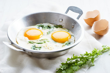 fried egg with green spinach