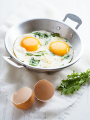 fried egg with green spinach