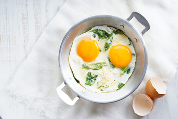 fried egg with green spinach