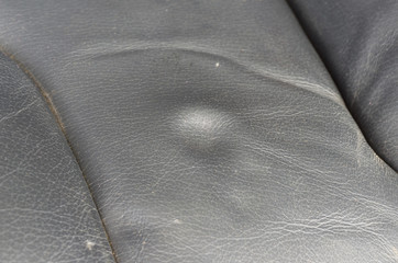 Dent on leather seat